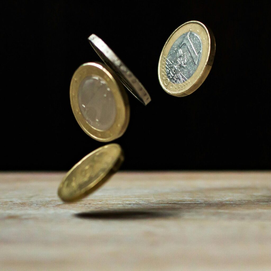 Dynamic shot of euro coins appearing to float, symbolizing active economy.